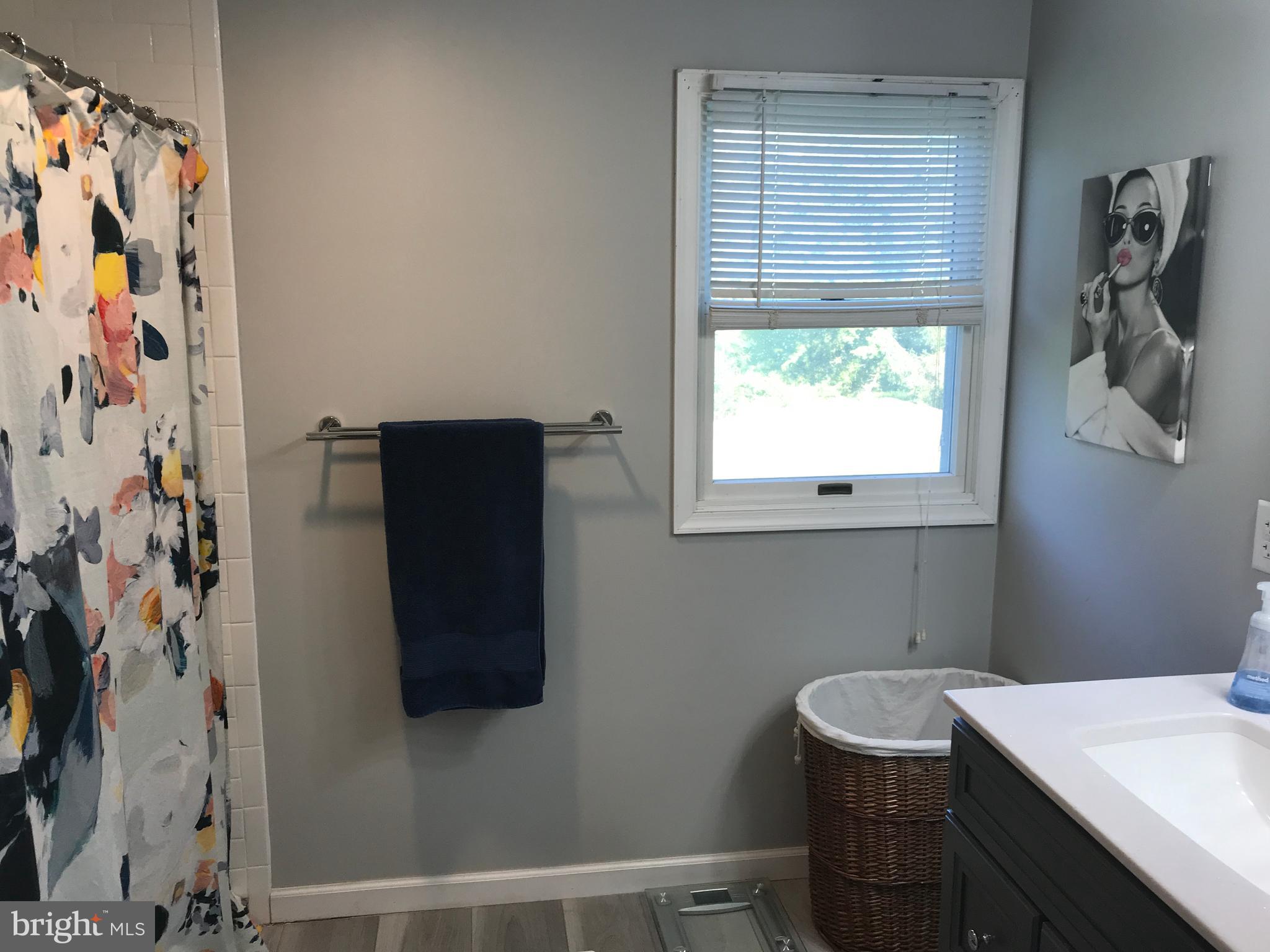 195 River Road Pequea, PA 17565 - Photo 52 of 77 a bathroom with a sink and a window