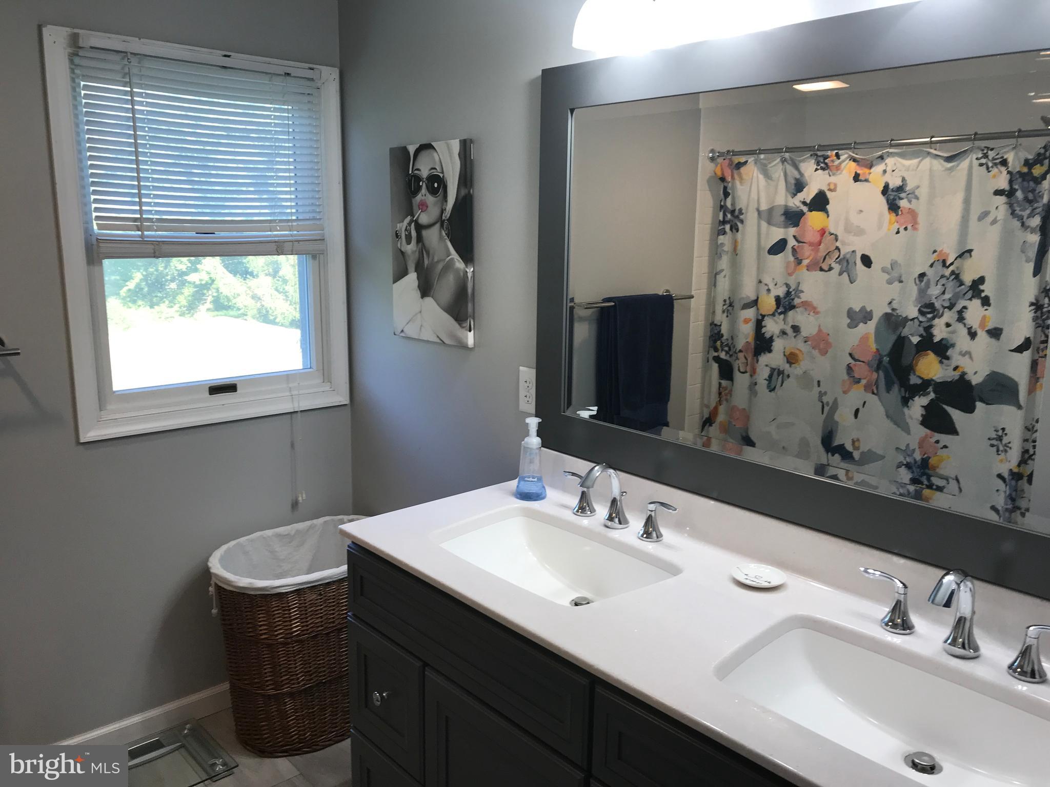 195 River Road Pequea, PA 17565 - Photo 53 of 77 a bathroom with a double vanity sink toilet and a mirror