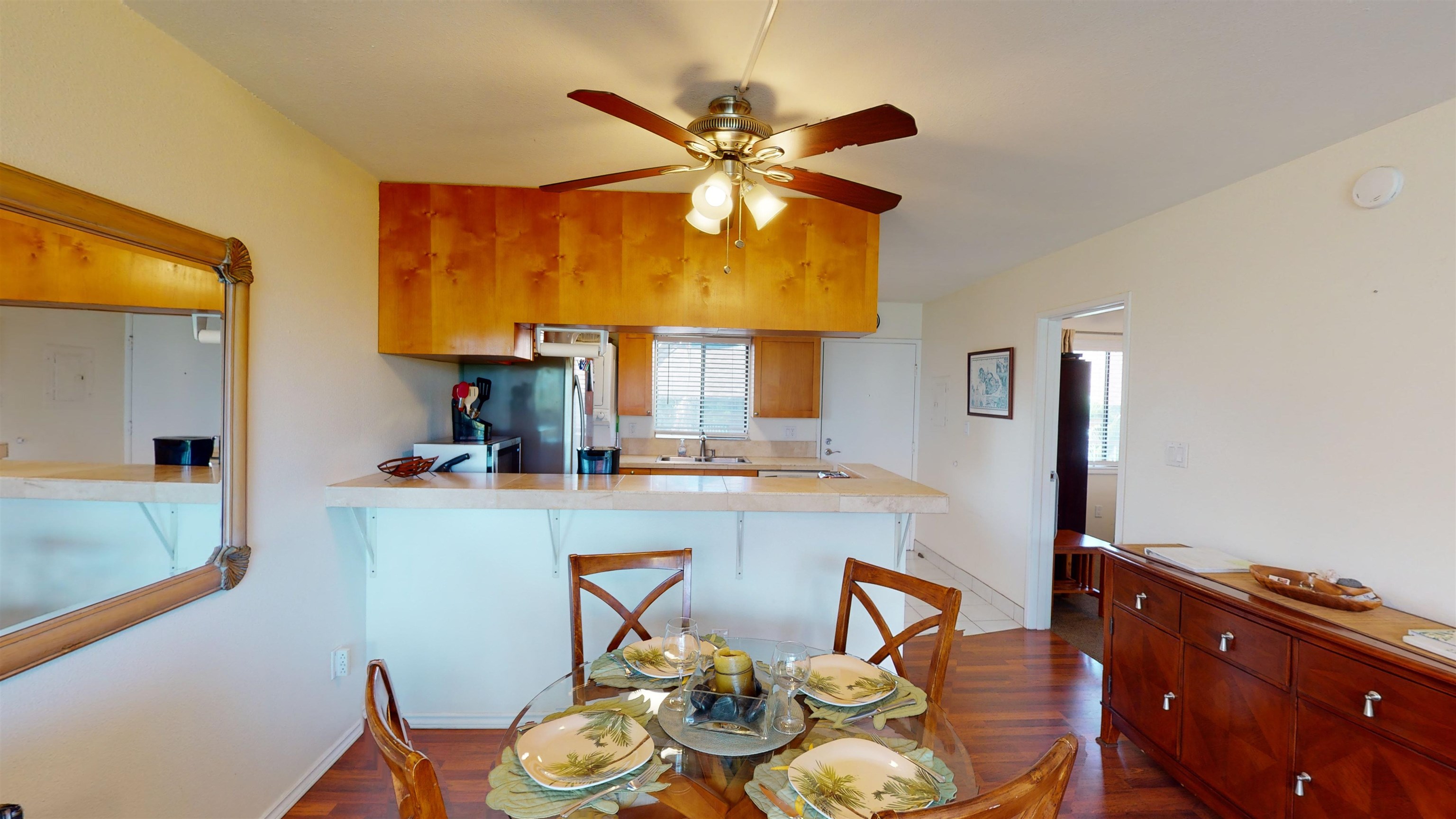 2219 South Kihei Road, Unit A408 Kihei, HI 96753 - Photo 11 of 30 a kitchen with a table and chairs