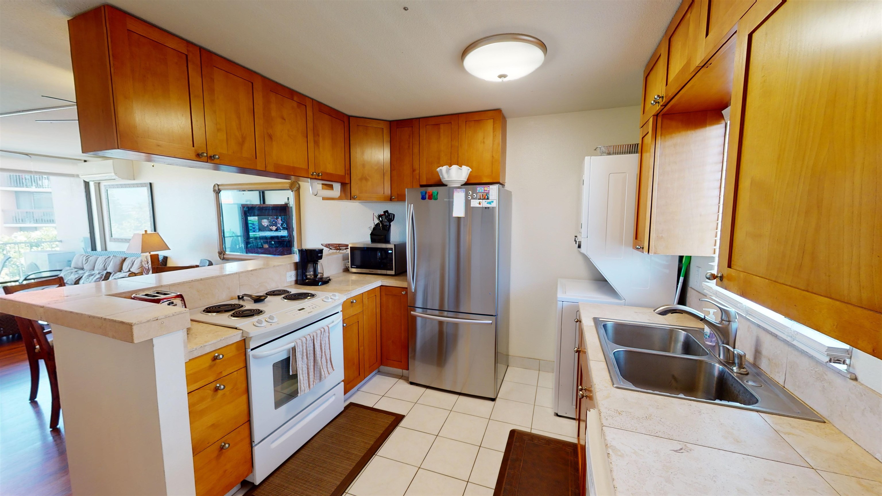 2219 South Kihei Road, Unit A408 Kihei, HI 96753 - Photo 17 of 30 a kitchen that has a stove and a refrigerator