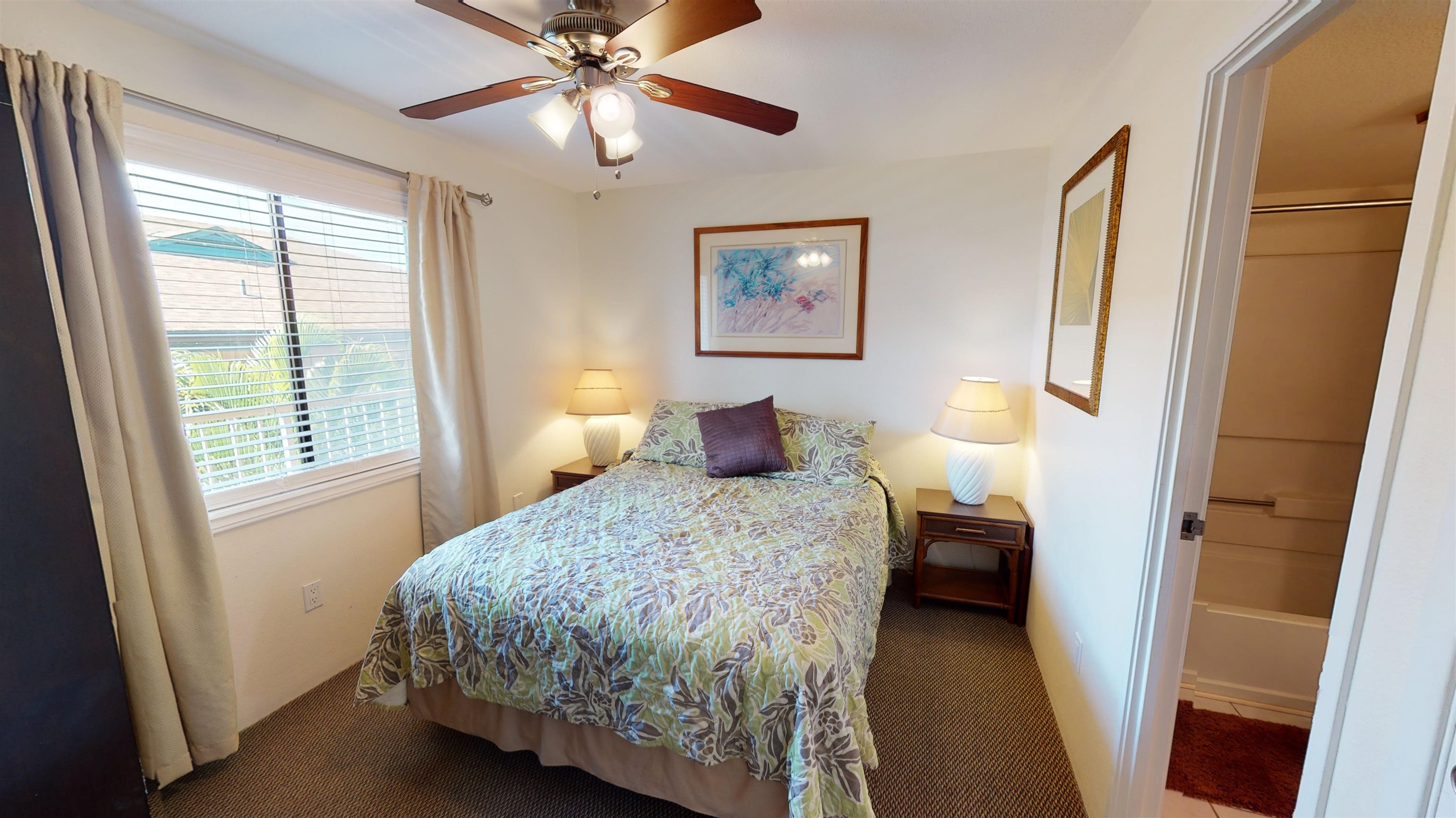 2219 South Kihei Road, Unit A408 Kihei, HI 96753 - Photo 19 of 30 a bedroom with a bed and a chandelier