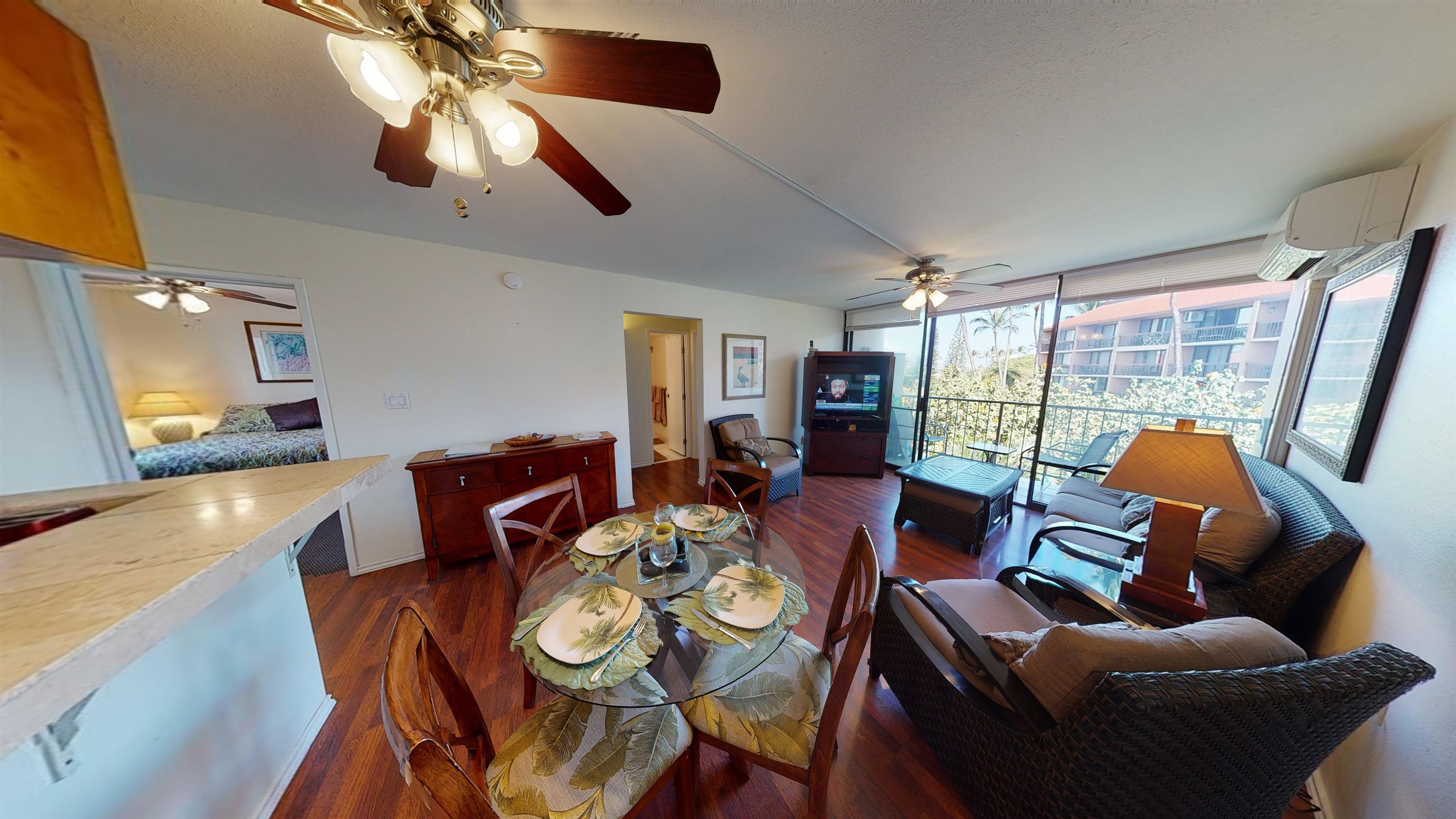2219 South Kihei Road, Unit A408 Kihei, HI 96753 - Photo 5 of 30 a living room with furniture and a flat screen tv