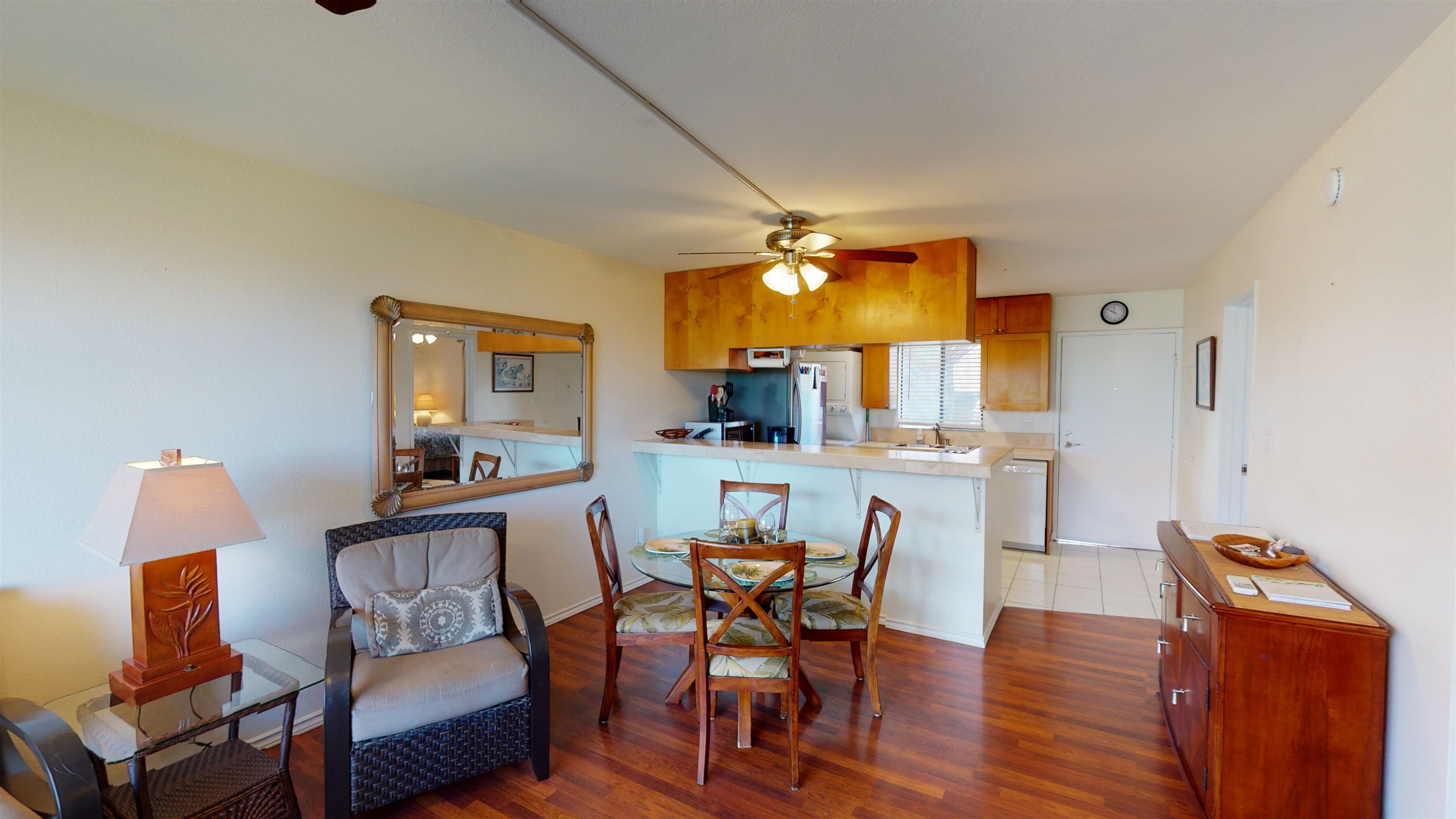2219 South Kihei Road, Unit A408 Kihei, HI 96753 - Photo 10 of 30 a view of a dining room with furniture and wooden floor