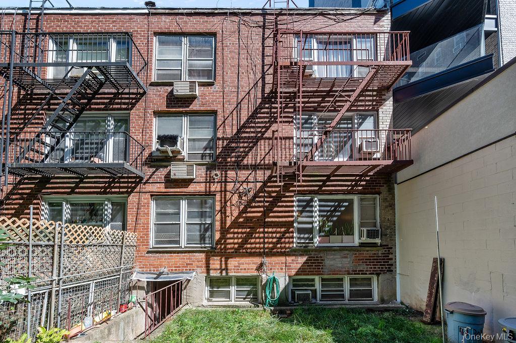 41-30 45th Street Queens, NY 11104 - Photo 13 of 16 front view of a building with a street