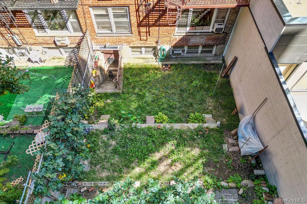 41-30 45th Street Queens, NY 11104 - Photo 14 of 16 a backyard of a house with lots of green space