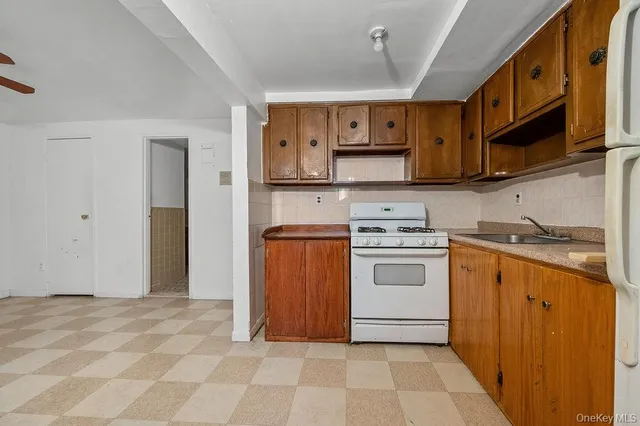 a kitchen with stainless steel appliances granite countertop a stove and a sink
