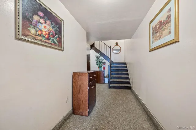 a view of a hallway with stairs