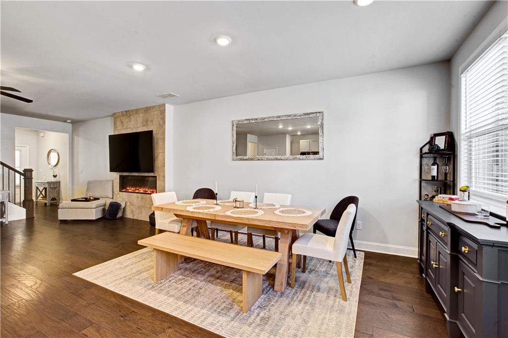 3434 Senna Road Duluth, GA 30096 - Photo 11 of 39 a living room with furniture and a flat screen tv