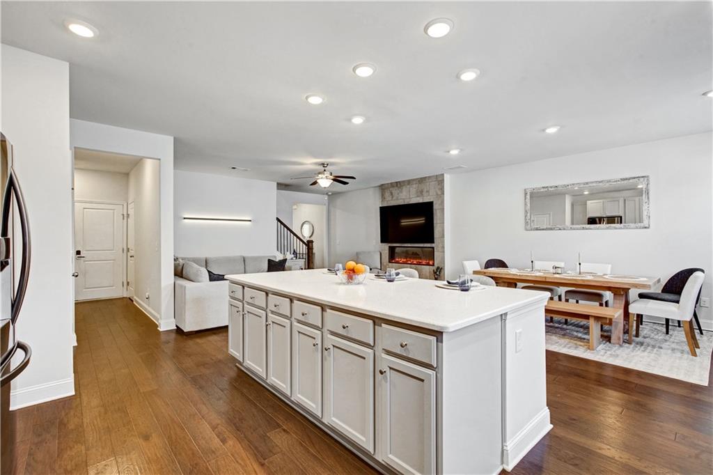 3434 Senna Road Duluth, GA 30096 - Photo 16 of 39 a large white kitchen with a large island in the center