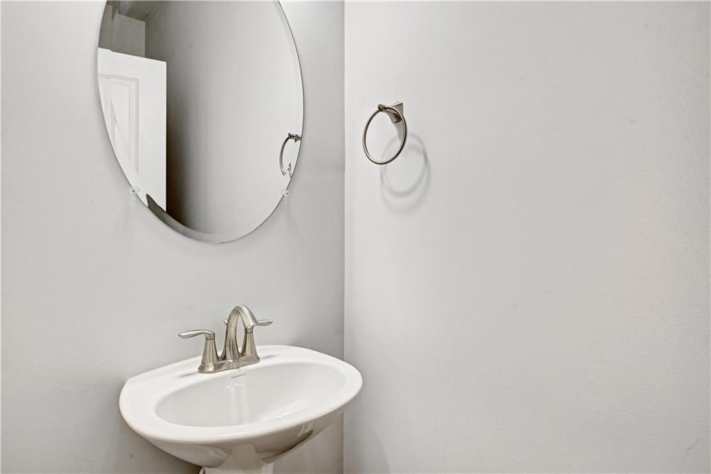 3434 Senna Road Duluth, GA 30096 - Photo 18 of 39 a bathroom with a sink and a mirror