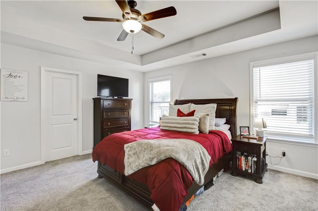 3434 Senna Road Duluth, GA 30096 - Photo 22 of 39 a bedroom with a bed and a tv