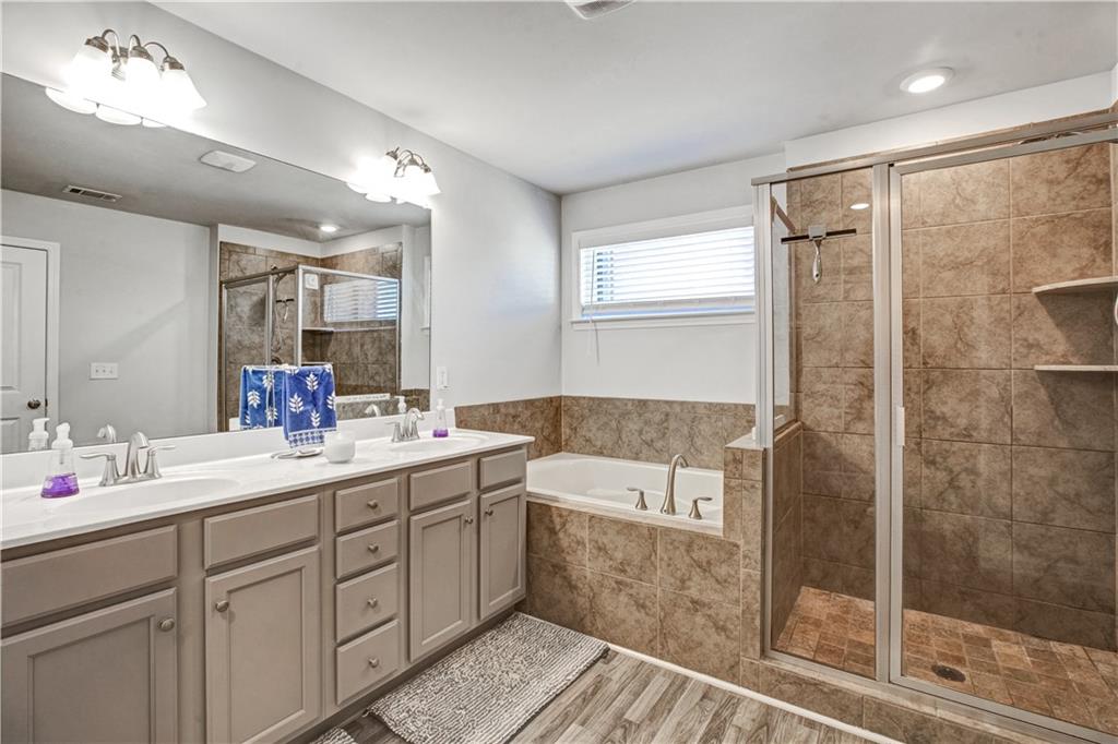 3434 Senna Road Duluth, GA 30096 - Photo 26 of 39 a bathroom with a double vanity sink mirror and shower