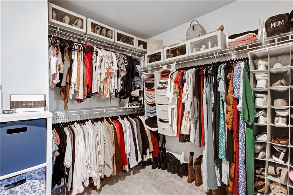 3434 Senna Road Duluth, GA 30096 - Photo 29 of 39 a view of walk in closet with clothes and shoes