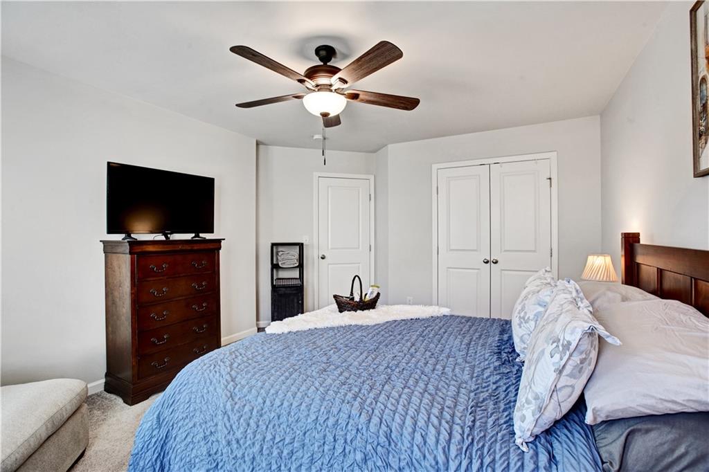 3434 Senna Road Duluth, GA 30096 - Photo 31 of 39 a bedroom with a bed and a flat screen tv
