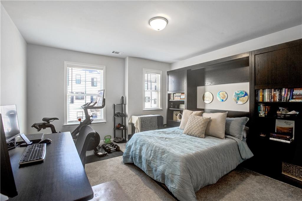 3434 Senna Road Duluth, GA 30096 - Photo 34 of 39 a bedroom with a bed a couch and dresser