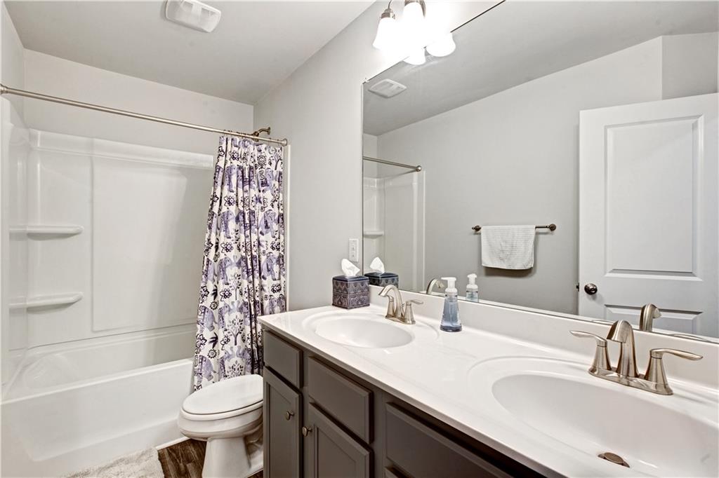3434 Senna Road Duluth, GA 30096 - Photo 35 of 39 a bathroom with a sink toilet tub and shower