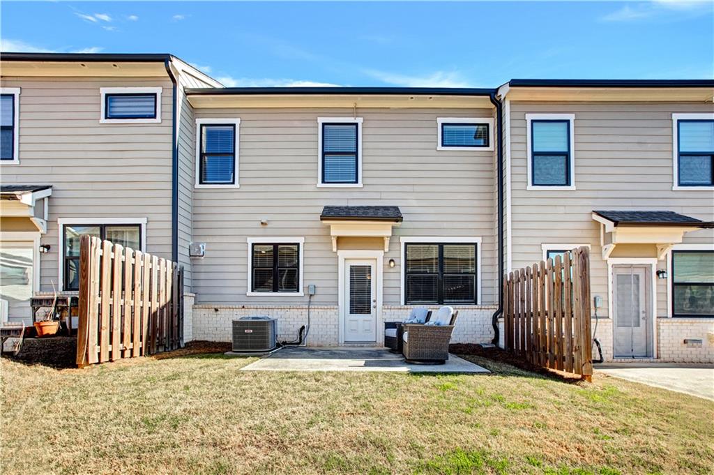 3434 Senna Road Duluth, GA 30096 - Photo 37 of 39 a view of a house with a patio and a yard