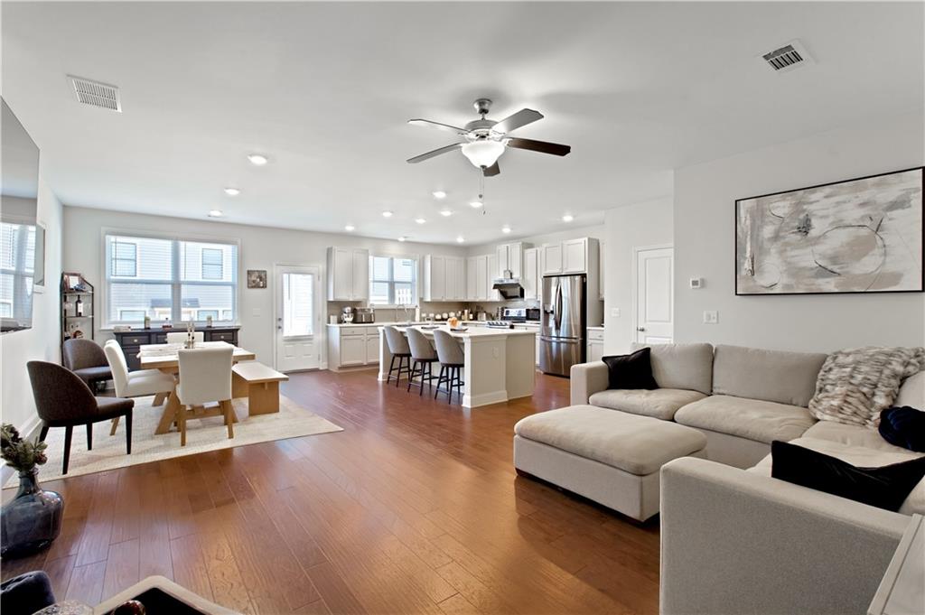 3434 Senna Road Duluth, GA 30096 - Photo 6 of 39 a living room with furniture and kitchen view