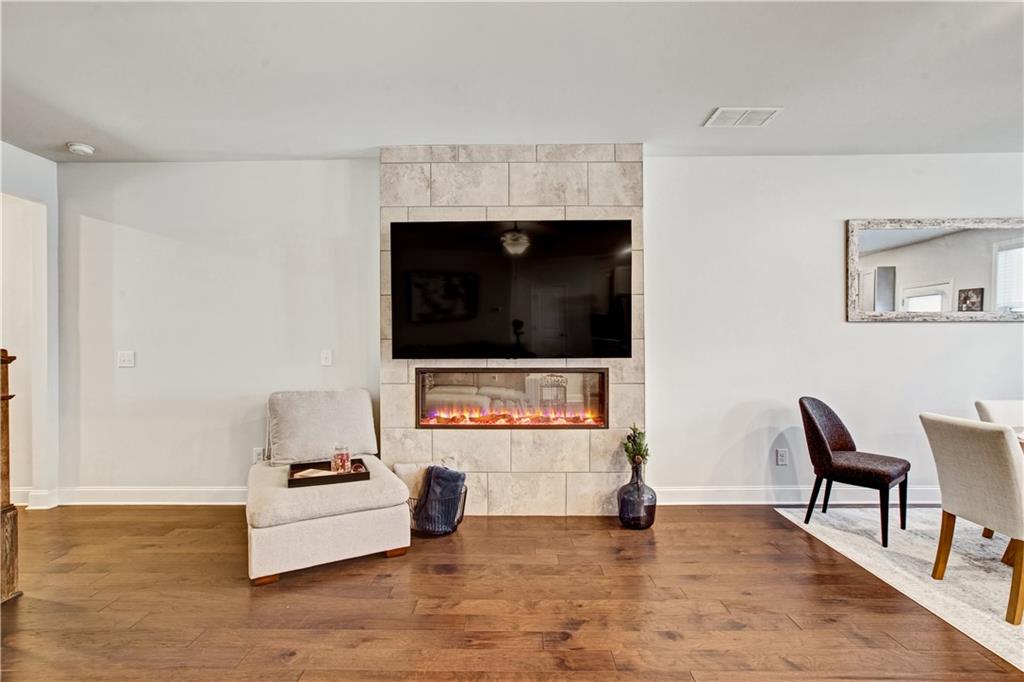 3434 Senna Road Duluth, GA 30096 - Photo 7 of 39 a living room with furniture and a flat screen tv