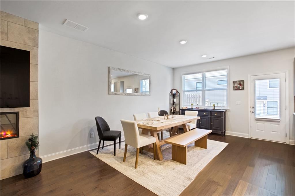 3434 Senna Road Duluth, GA 30096 - Photo 10 of 39 a view of a workspace with furniture and a flat screen tv