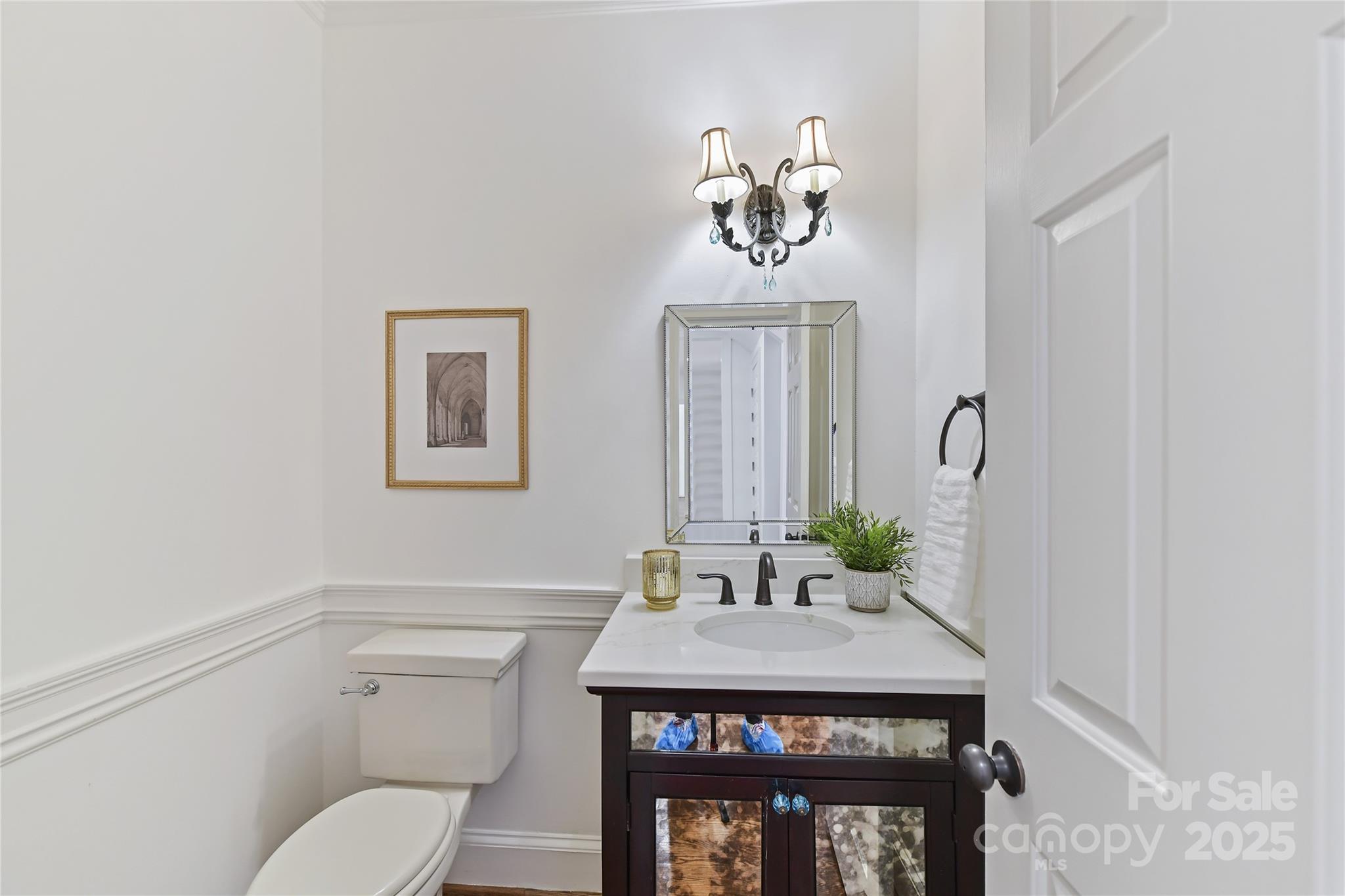 18512 Square Sail Road Cornelius, NC 28031 - Photo 11 of 40 a bathroom with a sink mirror and toilet