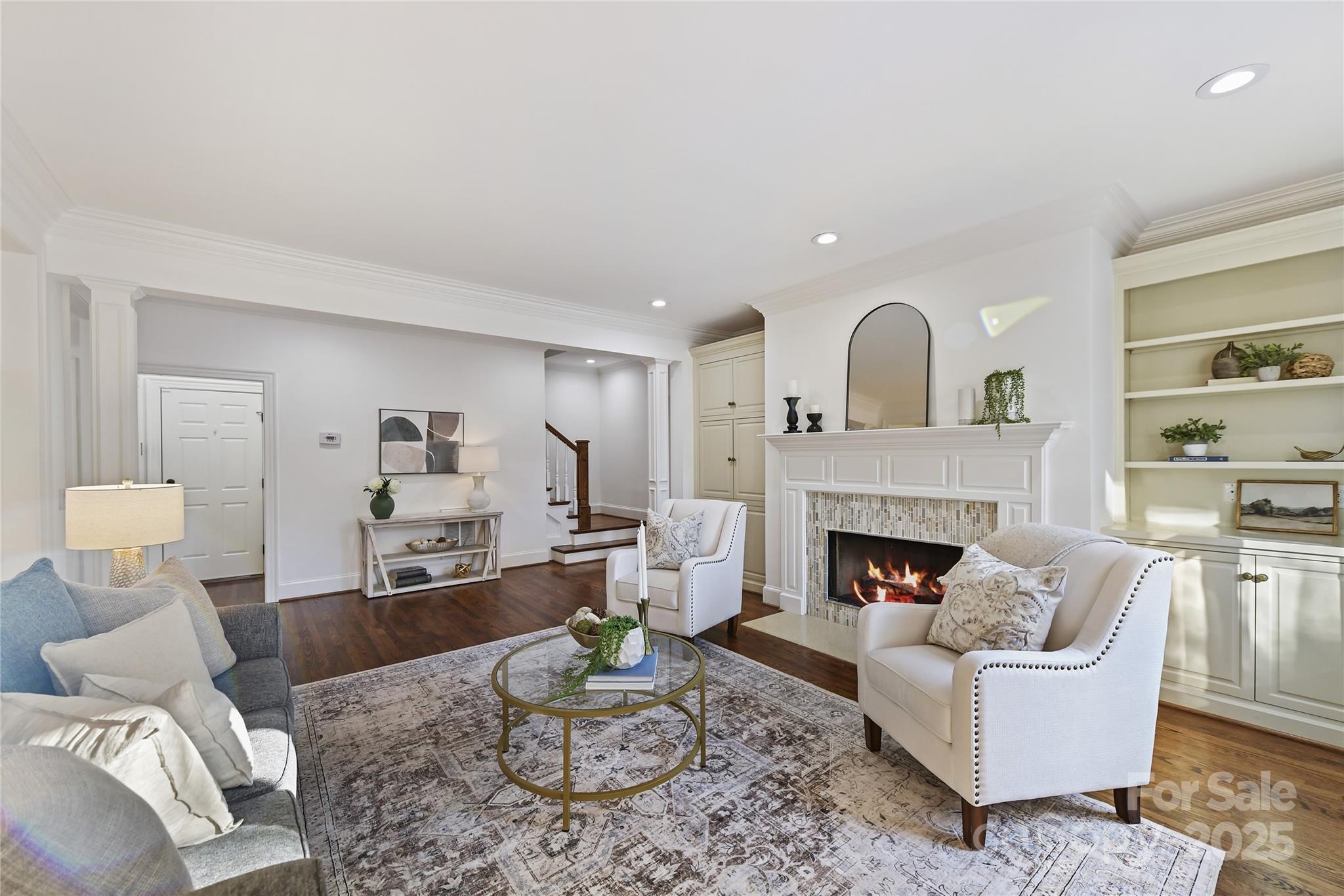 18512 Square Sail Road Cornelius, NC 28031 - Photo 12 of 40 a living room with furniture and a fireplace