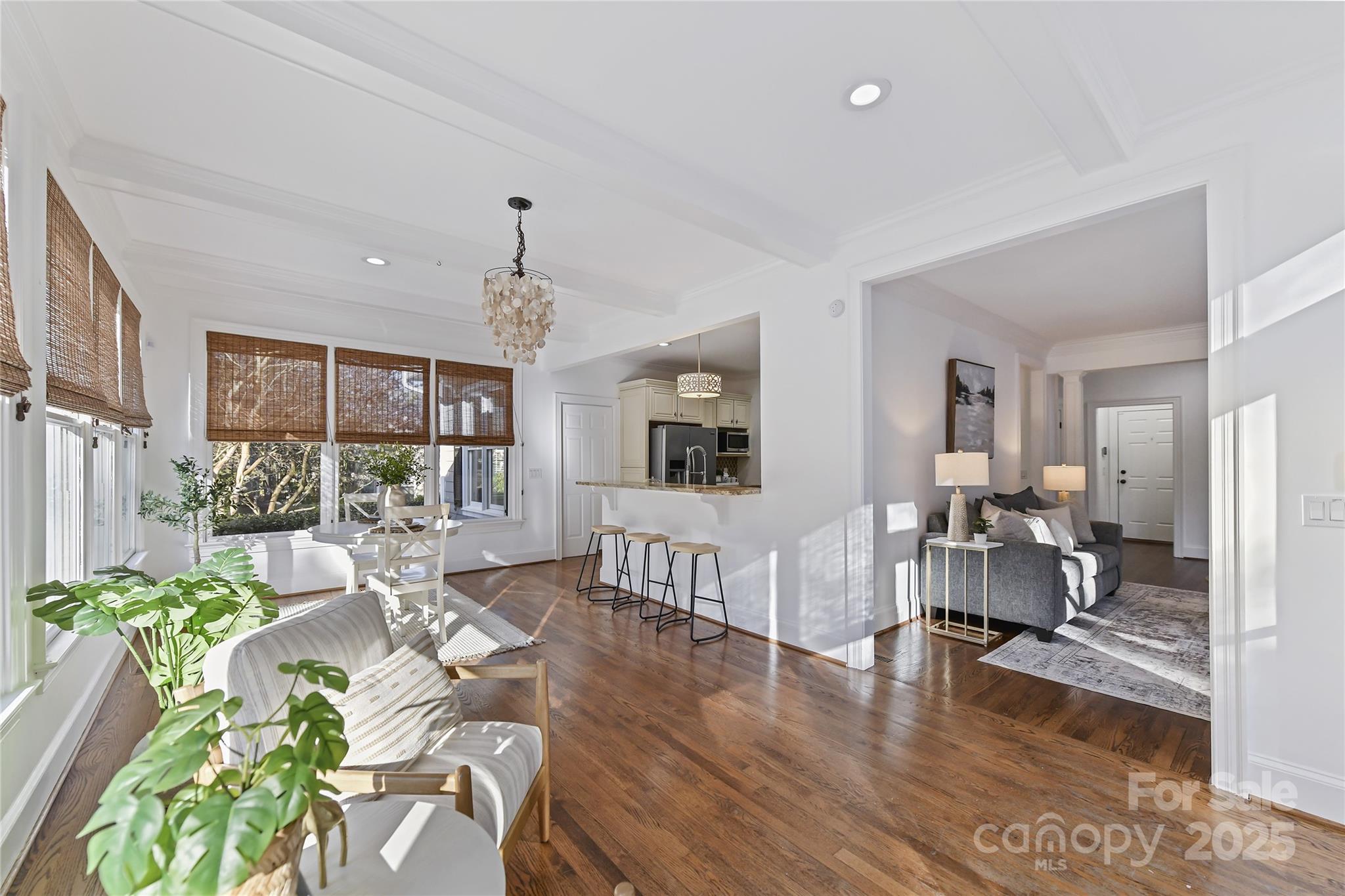 18512 Square Sail Road Cornelius, NC 28031 - Photo 18 of 40 a living room filled with furniture and a chandelier