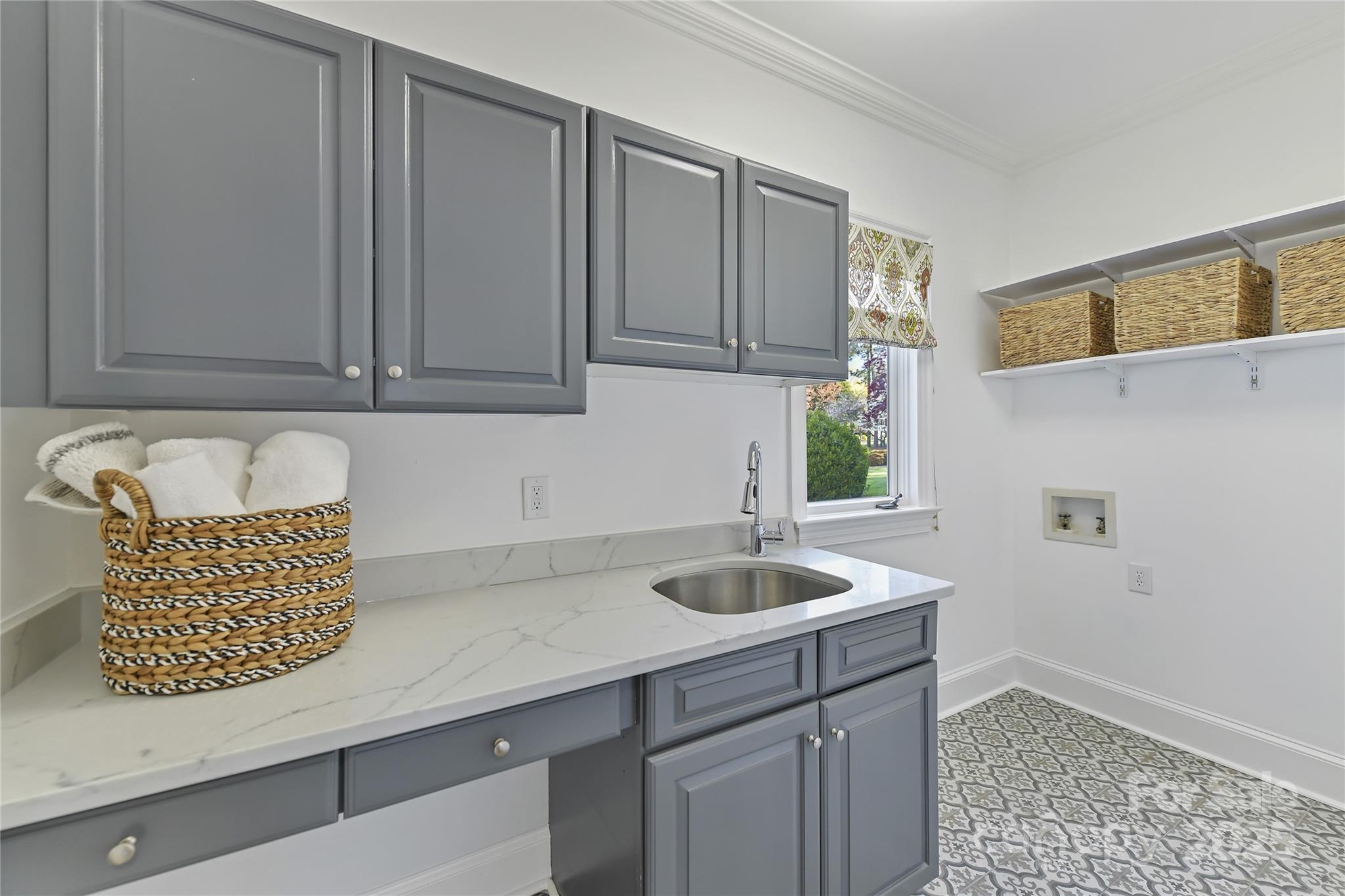 18512 Square Sail Road Cornelius, NC 28031 - Photo 19 of 40 a kitchen with a sink and cabinets