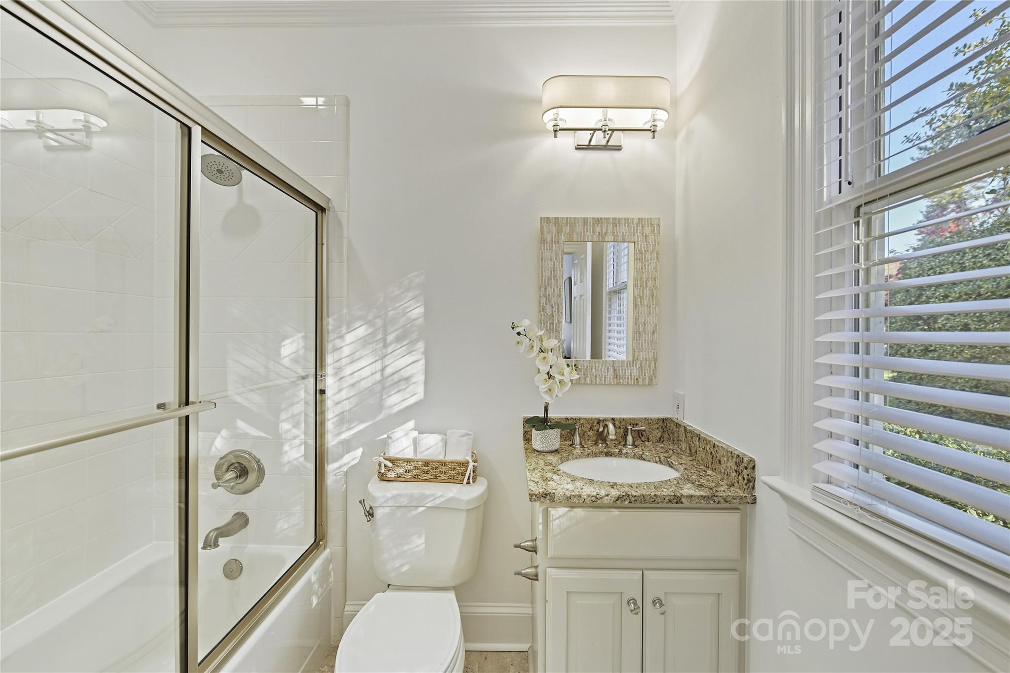 18512 Square Sail Road Cornelius, NC 28031 - Photo 21 of 40 a bathroom with a granite countertop sink toilet and shower