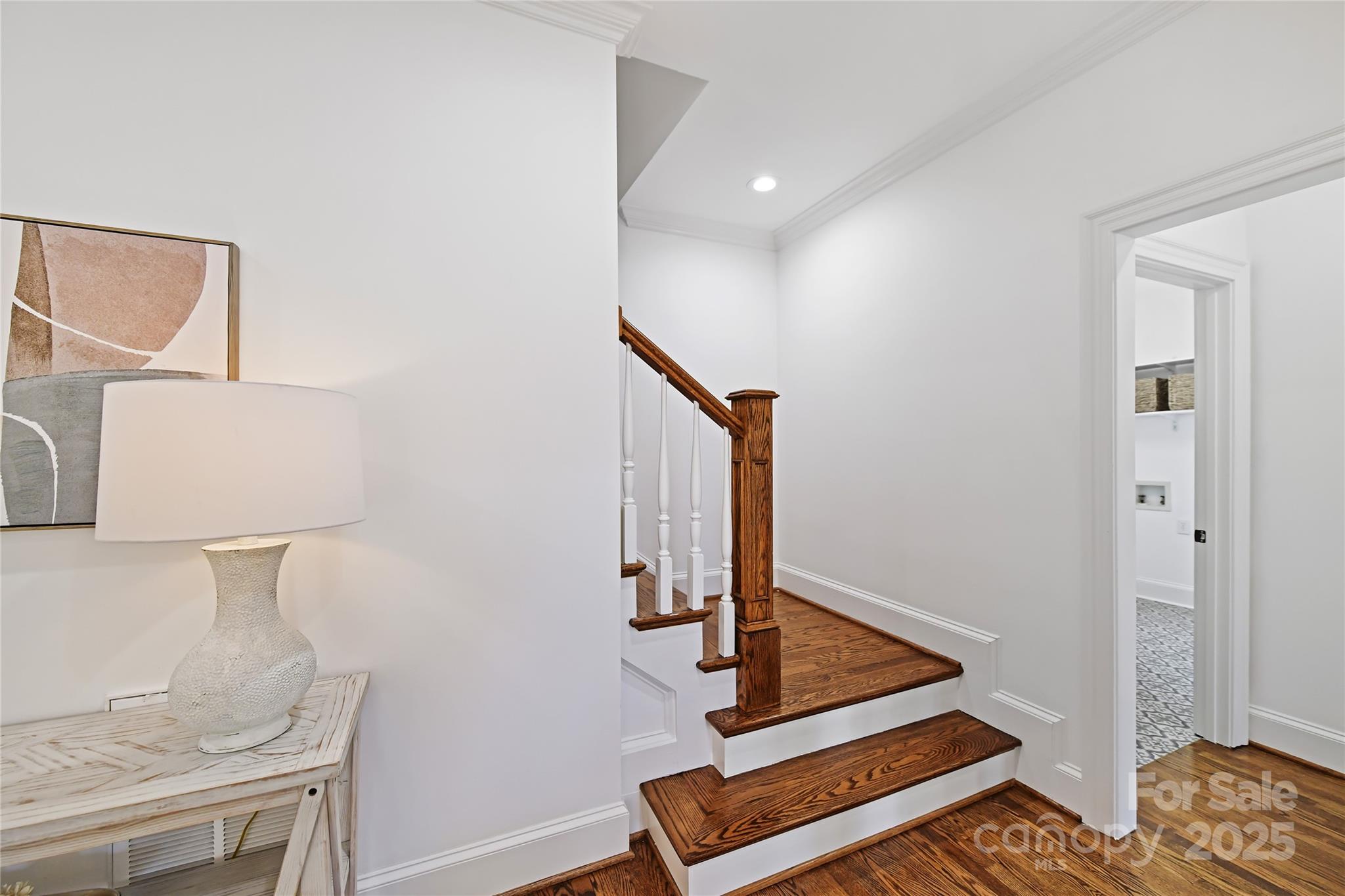18512 Square Sail Road Cornelius, NC 28031 - Photo 23 of 40 a view of staircase with white walls and a window