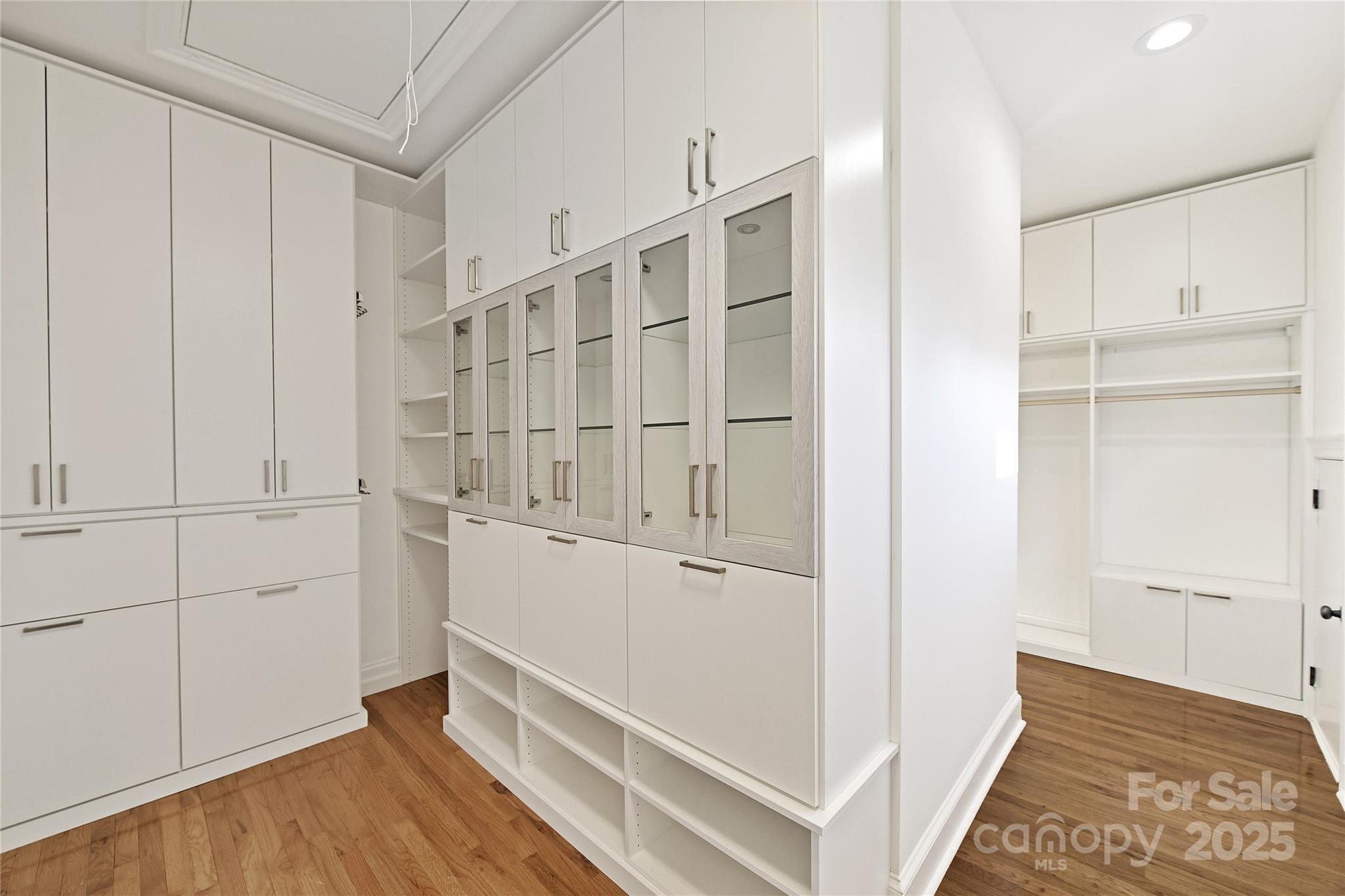 18512 Square Sail Road Cornelius, NC 28031 - Photo 28 of 40 a view of walk in closet with wooden floor