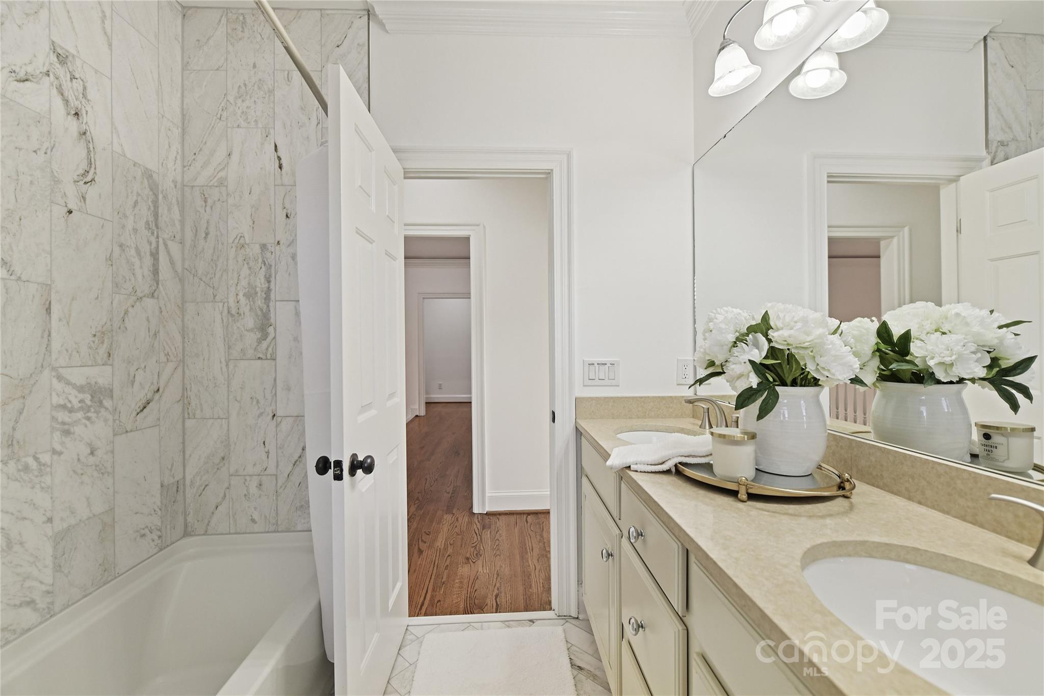 18512 Square Sail Road Cornelius, NC 28031 - Photo 31 of 40 a bathroom with a granite countertop sink a mirror and a bathtub