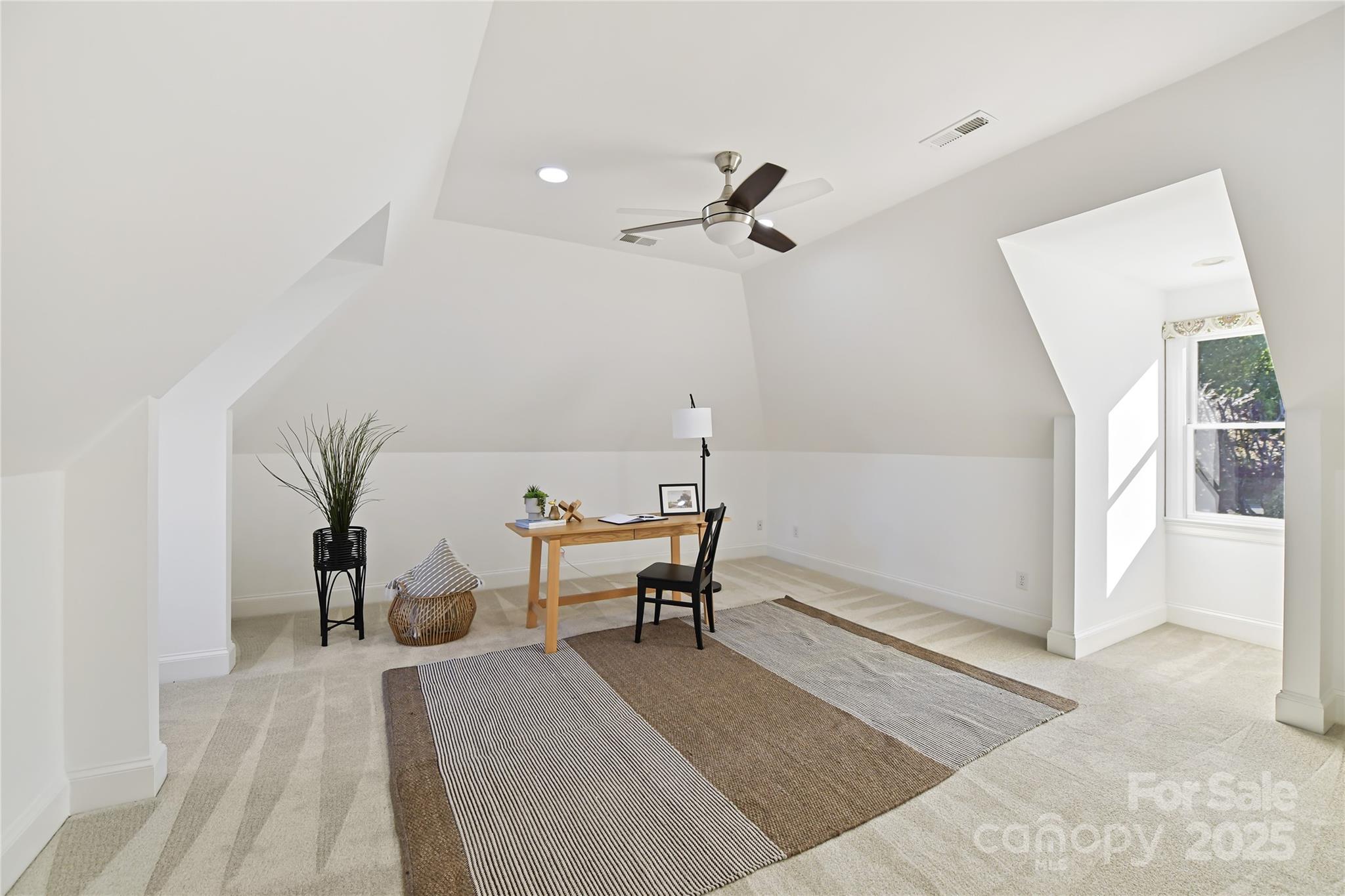 18512 Square Sail Road Cornelius, NC 28031 - Photo 33 of 40 a living room with furniture and a rug