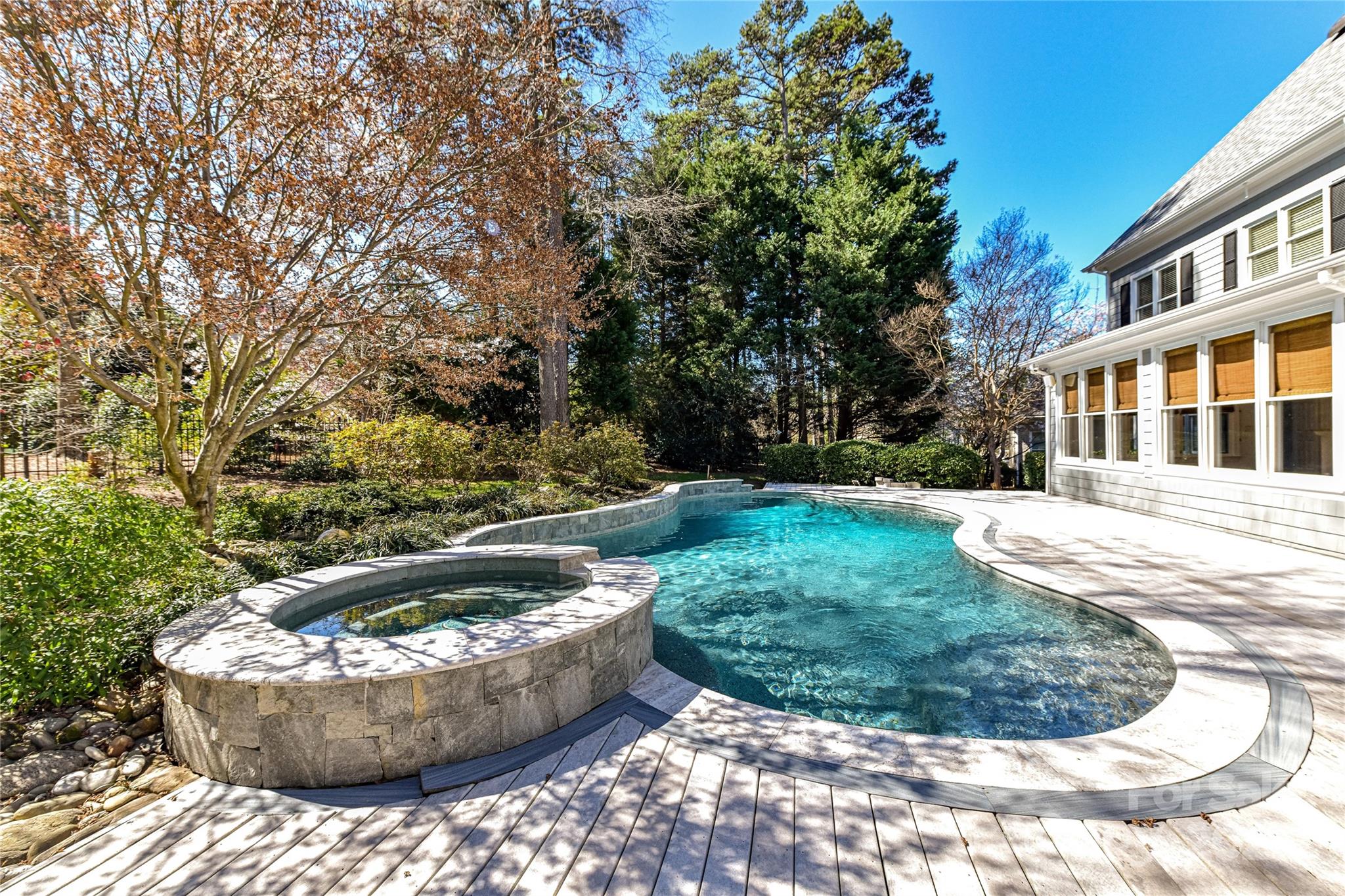 18512 Square Sail Road Cornelius, NC 28031 - Photo 36 of 40 a view of a swimming pool with a sitting space