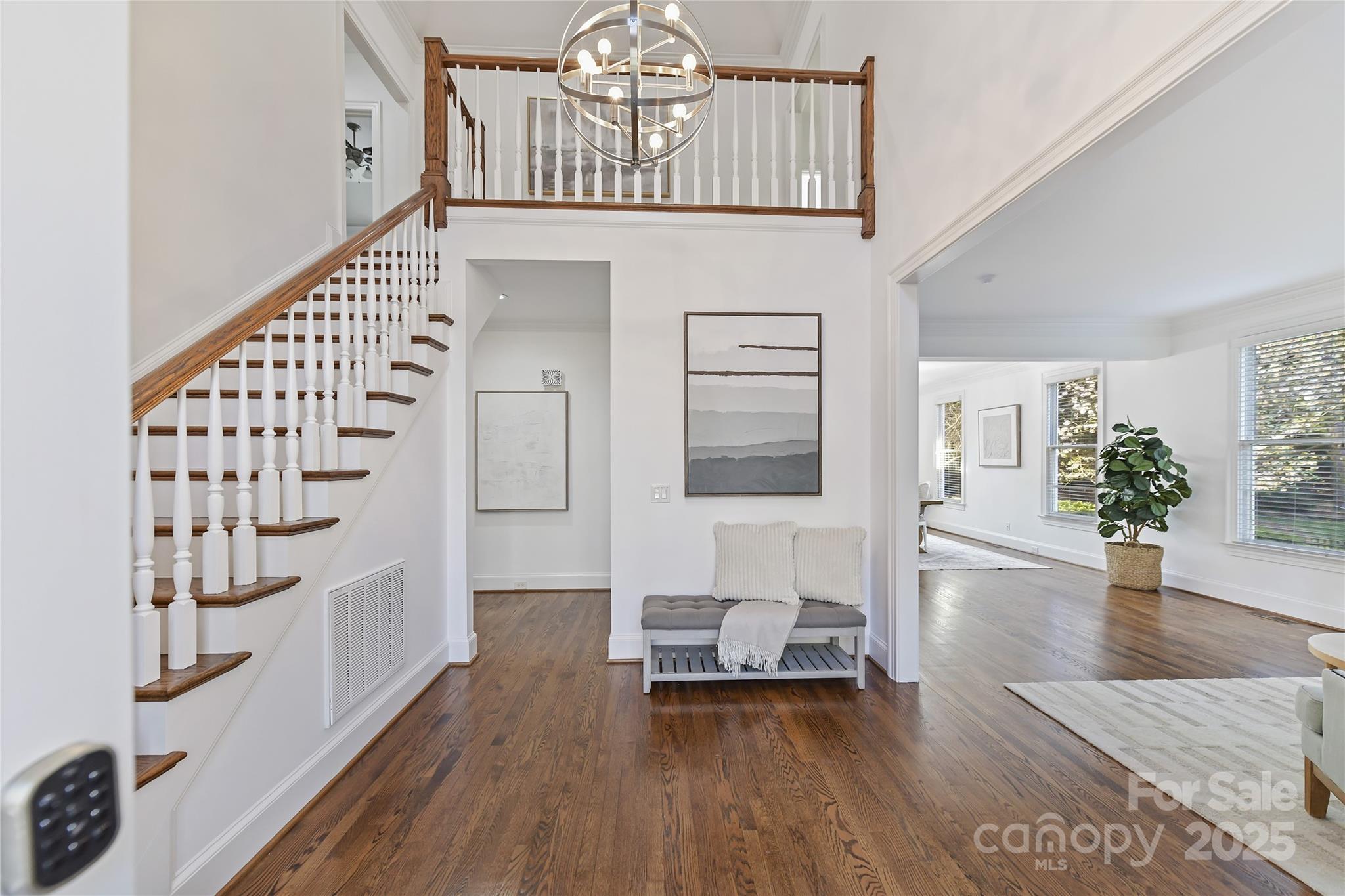 18512 Square Sail Road Cornelius, NC 28031 - Photo 6 of 40 a view of hall way with furniture and wooden floor