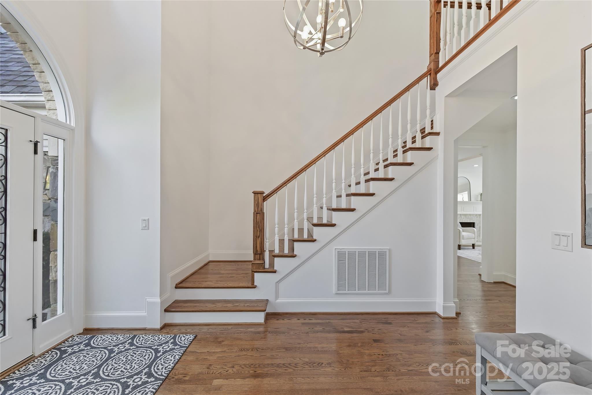 18512 Square Sail Road Cornelius, NC 28031 - Photo 7 of 40 a view of entryway and hall with wooden floor
