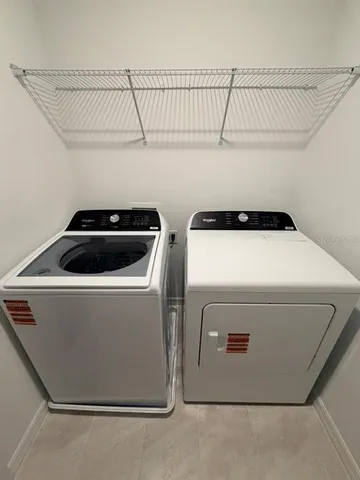 a utility room with dryer and washer
