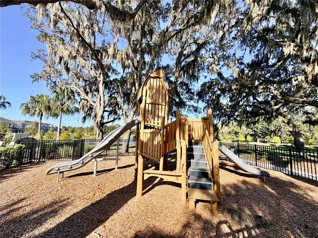 a view of a backyard with sitting area