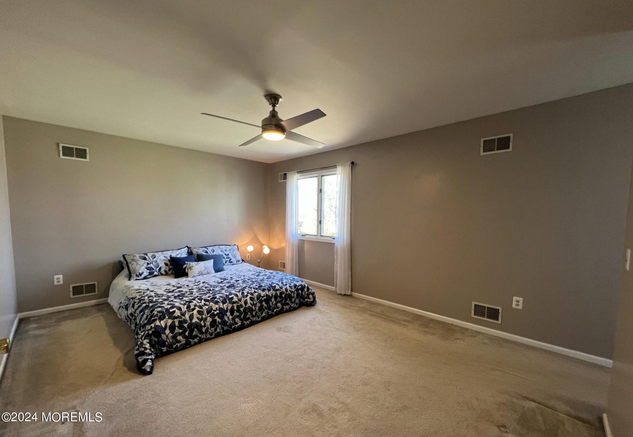 404 Drum Point Road Brick, NJ 08723 - Photo 13 of 22 a bedroom with a bed and a window