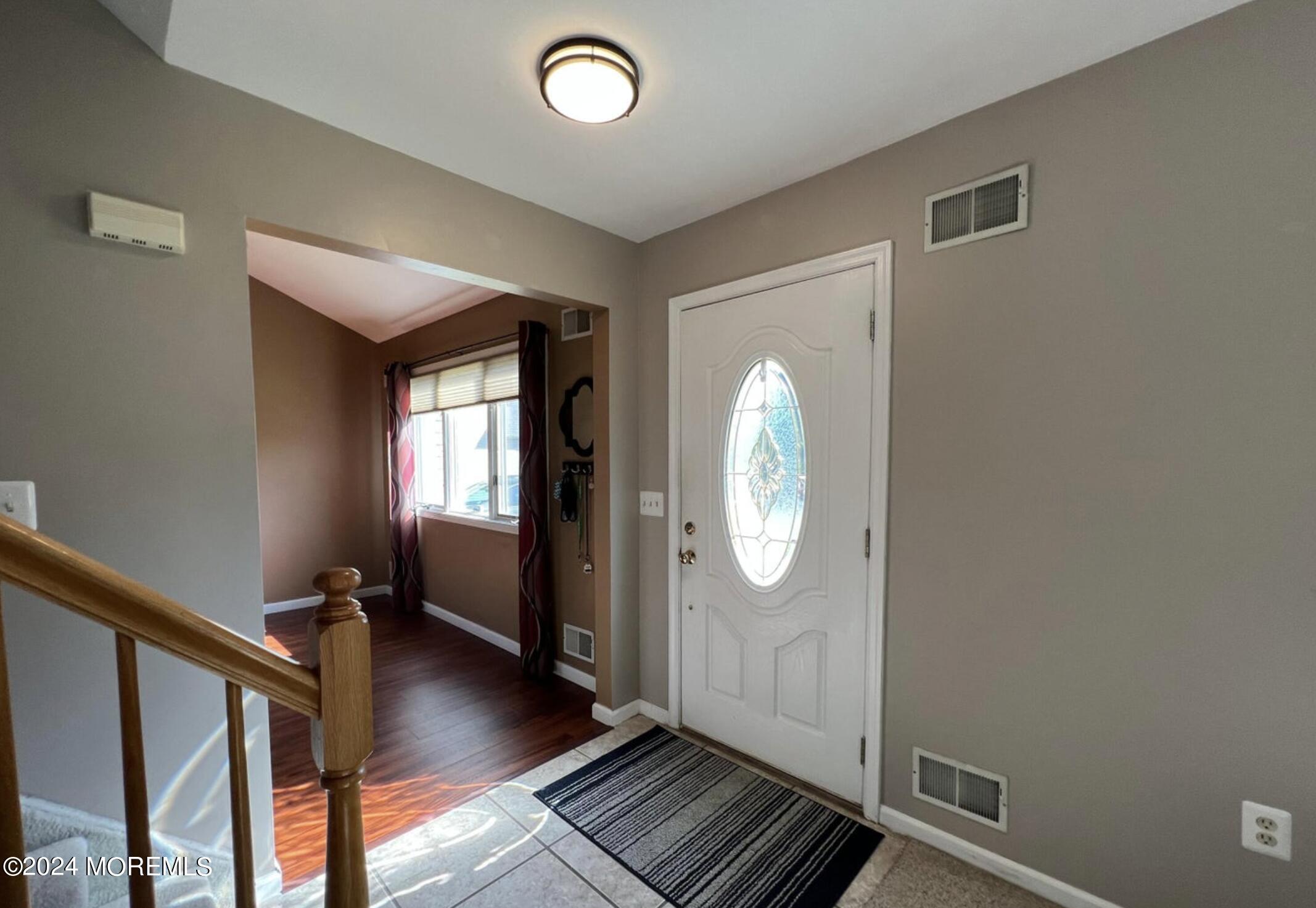 404 Drum Point Road Brick, NJ 08723 - Photo 2 of 22 a view of a livingroom with wooden floor