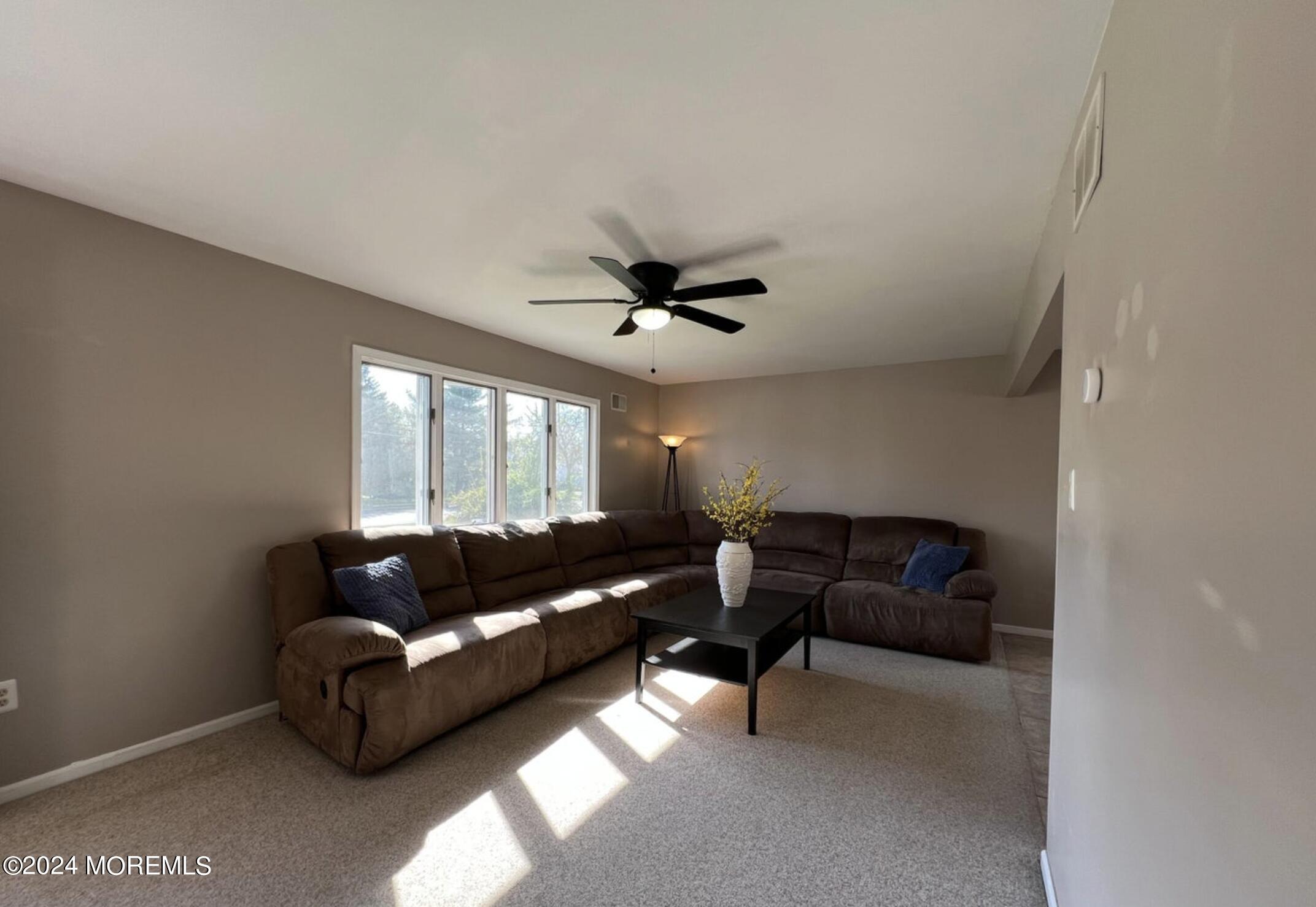 404 Drum Point Road Brick, NJ 08723 - Photo 4 of 22 a living room with furniture and a large window