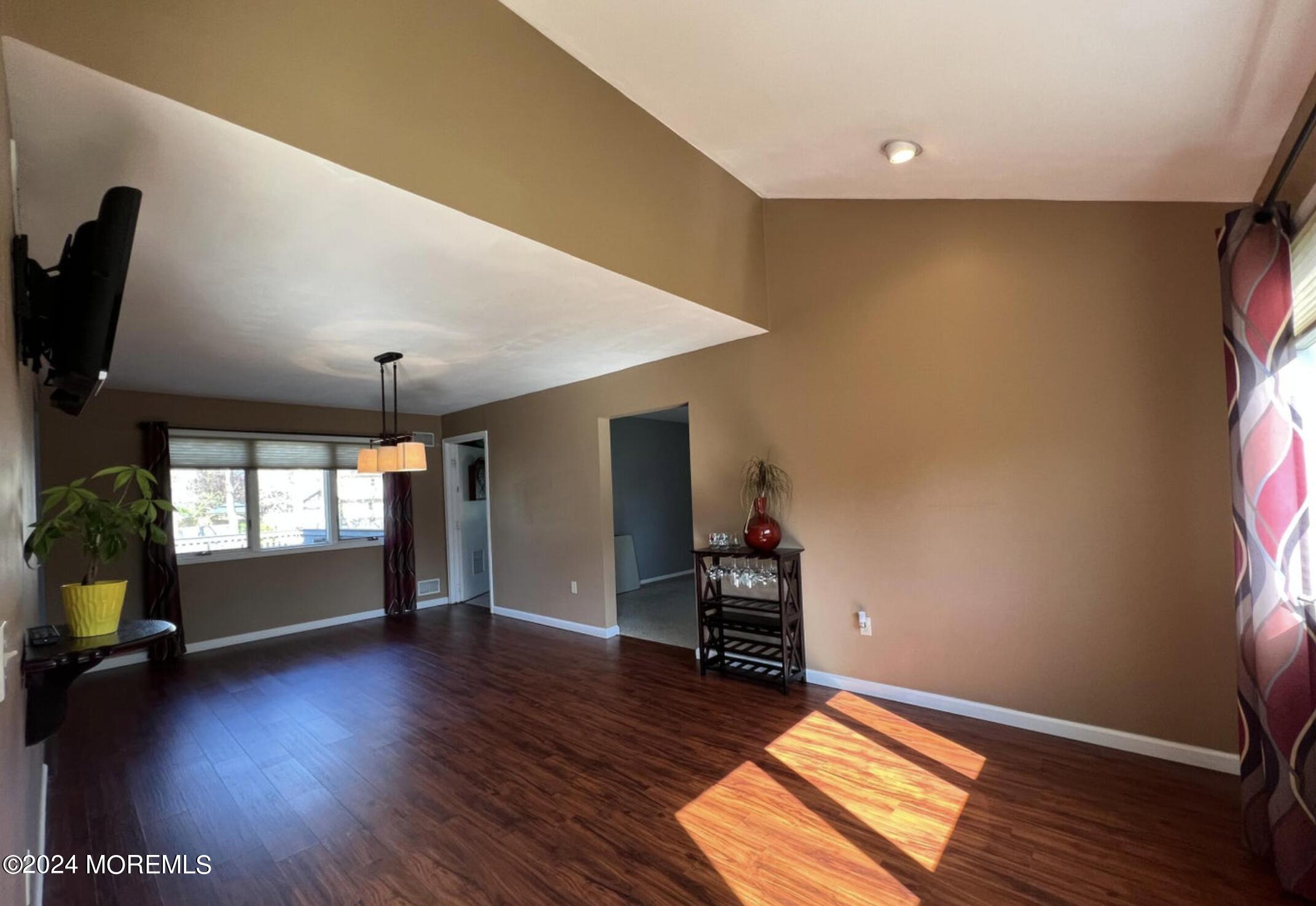 404 Drum Point Road Brick, NJ 08723 - Photo 7 of 22 a view of room with window and wooden floor