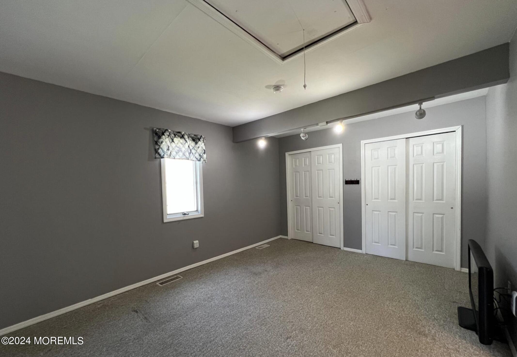 404 Drum Point Road Brick, NJ 08723 - Photo 8 of 22 a view of an empty room with a window