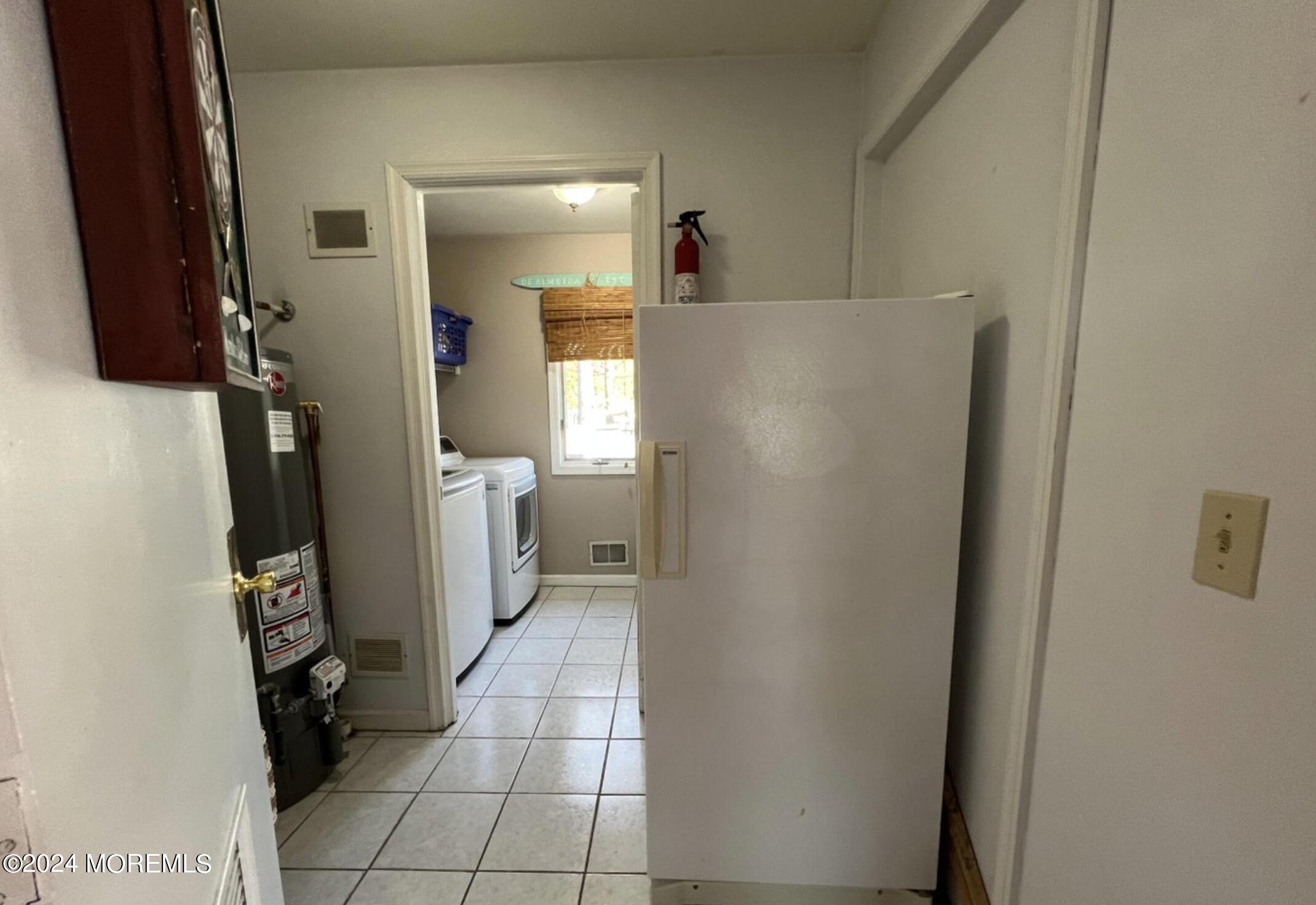 404 Drum Point Road Brick, NJ 08723 - Photo 9 of 22 a view of a storage & utility room with closet dryer