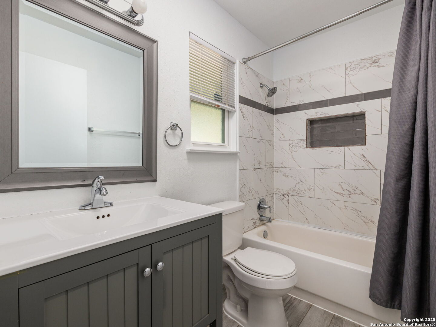 422 Bridgit Drive Converse, TX 78109 - Photo 11 of 17 a bathroom with a sink a toilet and shower
