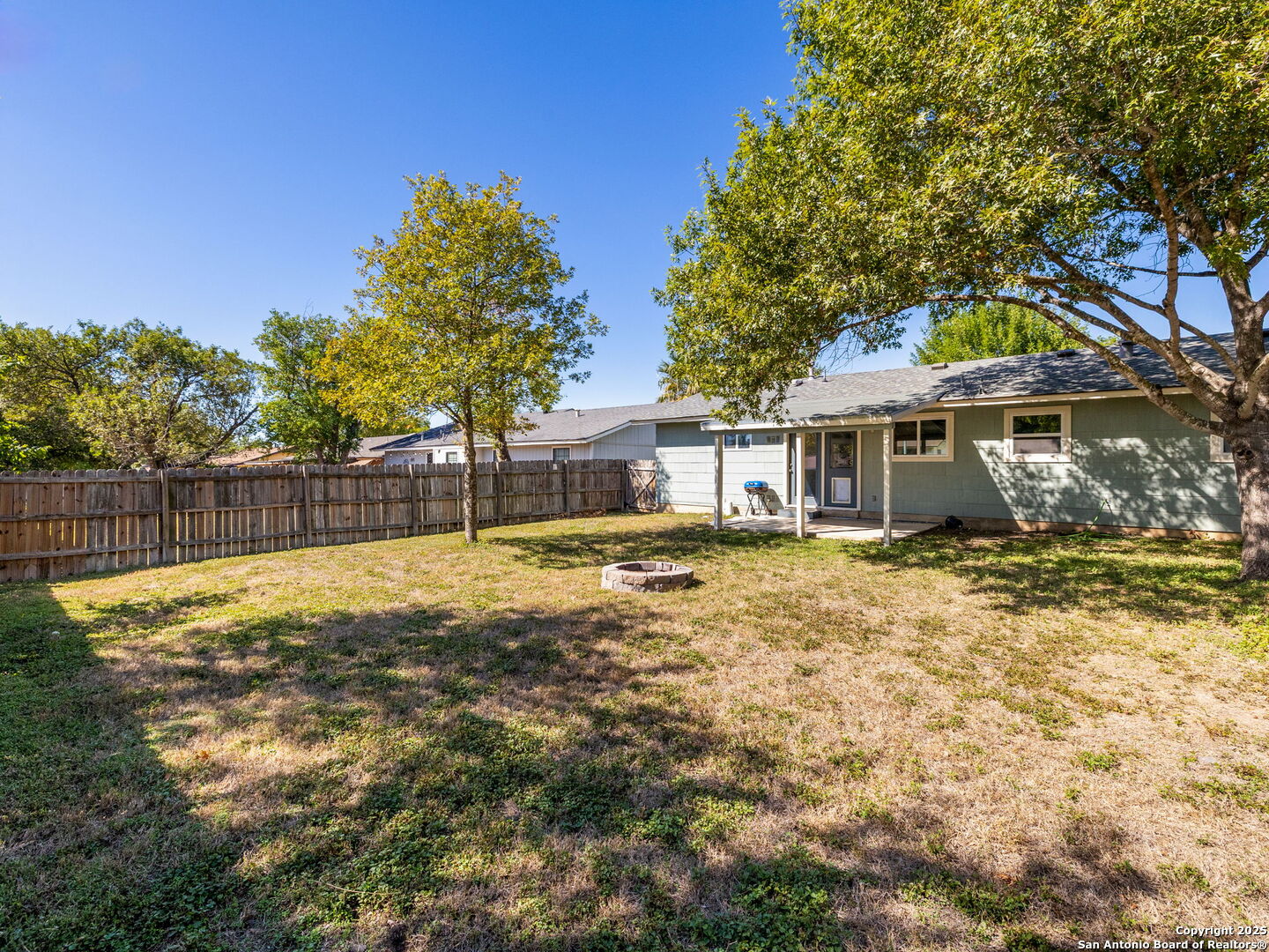 422 Bridgit Drive Converse, TX 78109 - Photo 16 of 17 a house with trees in the background