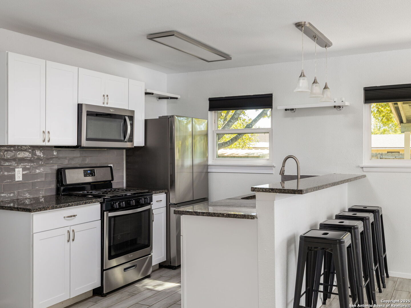 422 Bridgit Drive Converse, TX 78109 - Photo 3 of 17 a kitchen with a sink appliances and cabinets