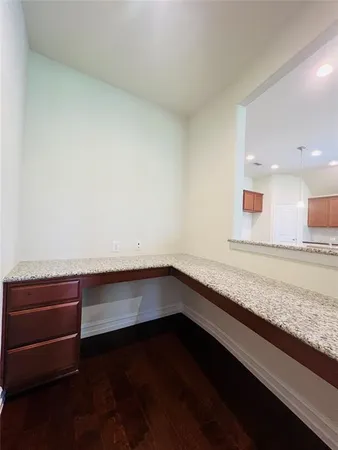 a room with water heater and wooden floor