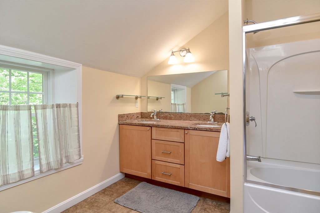 33 Grove Street Framingham, MA 01701 - Photo 17 of 33 a bathroom with a double vanity sink and mirror