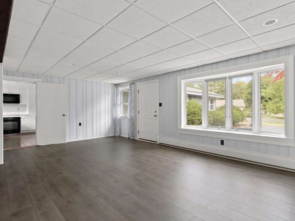 83 Joseph Road Framingham, MA 01701 - Photo 13 of 21 an empty room with wooden floor and windows